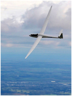 Eguene's glider high above the English countryside